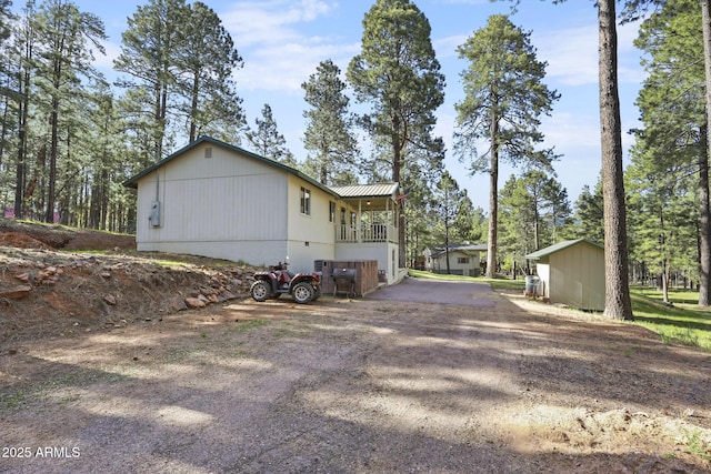 3017 Larson Loop, Forest Lakes, AZ 85931 - view of property exterior featuring metal roof