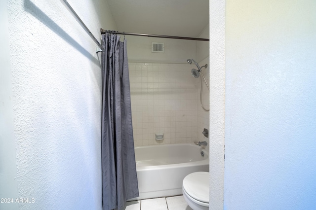 bathroom with tile patterned floors, toilet, and shower / bath combination with curtain