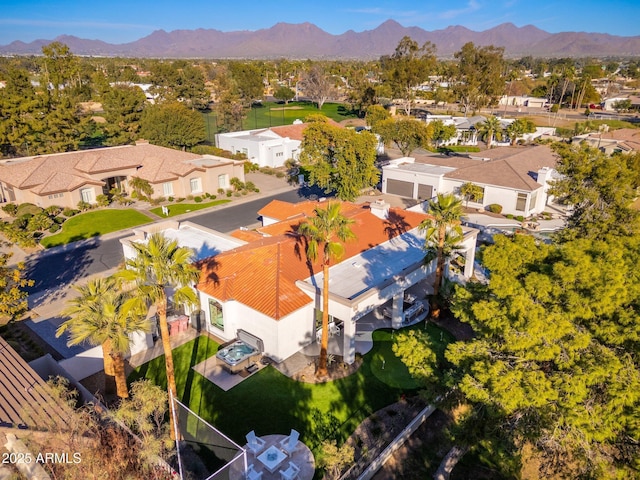 birds eye view of property featuring a mountain view