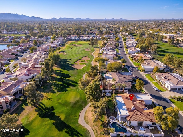 birds eye view of property with a mountain view