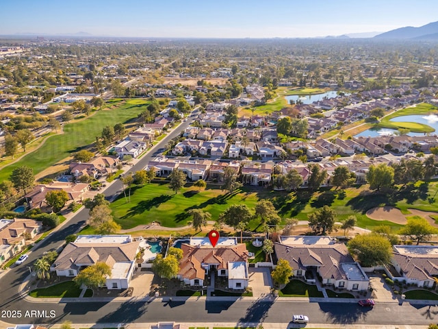 birds eye view of property featuring a water and mountain view