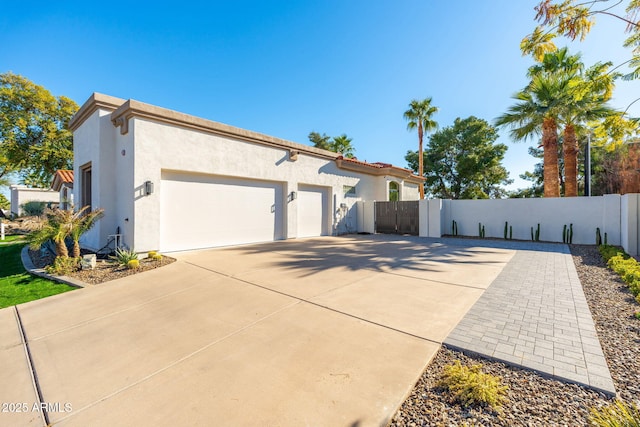 view of side of home featuring a garage