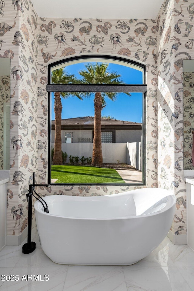 bathroom featuring a washtub