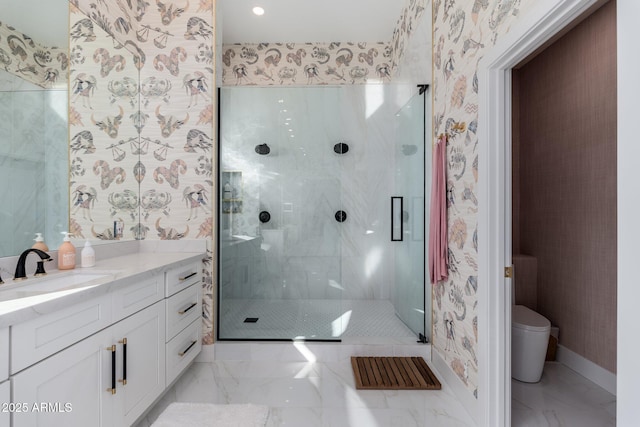 bathroom with vanity, toilet, and an enclosed shower