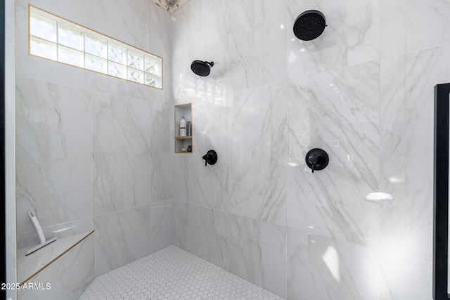 bathroom featuring a tile shower