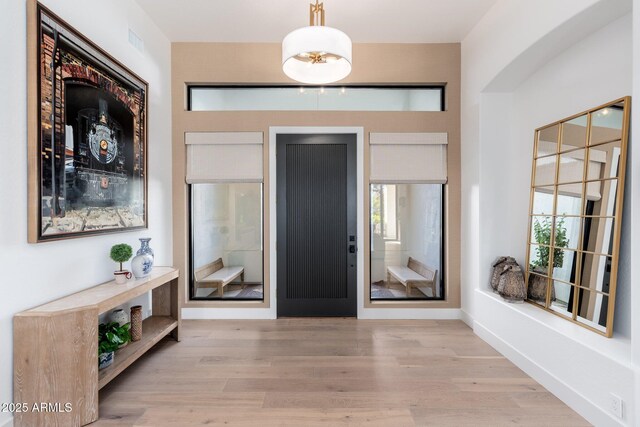 foyer with light hardwood / wood-style floors