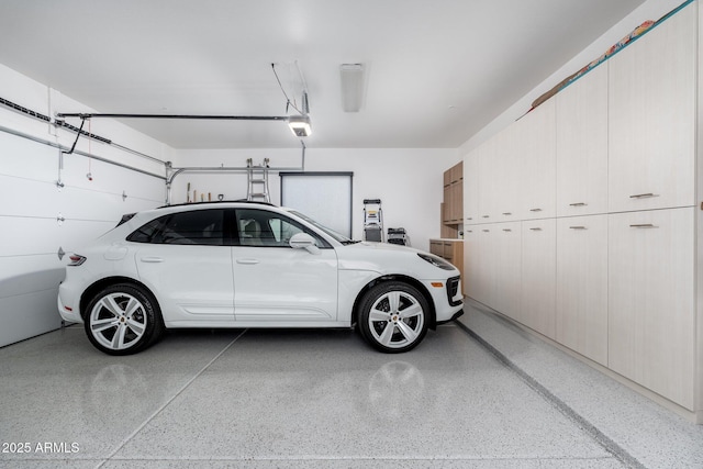 garage featuring a garage door opener