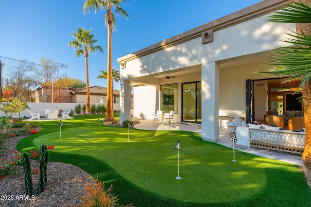 rear view of property with a patio area and outdoor lounge area