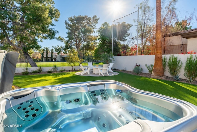 view of swimming pool featuring a yard, a patio, and a hot tub