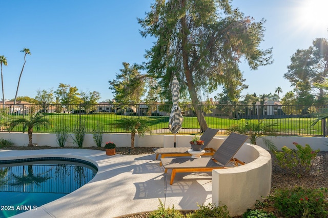 view of swimming pool with a patio