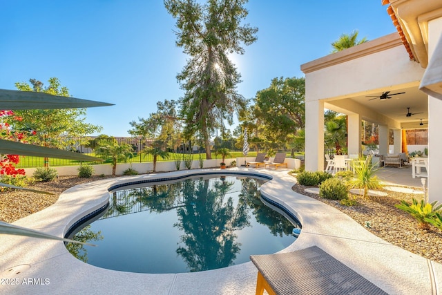 view of swimming pool with a patio area and ceiling fan