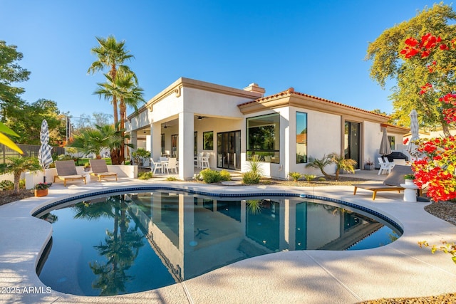 rear view of property featuring a patio