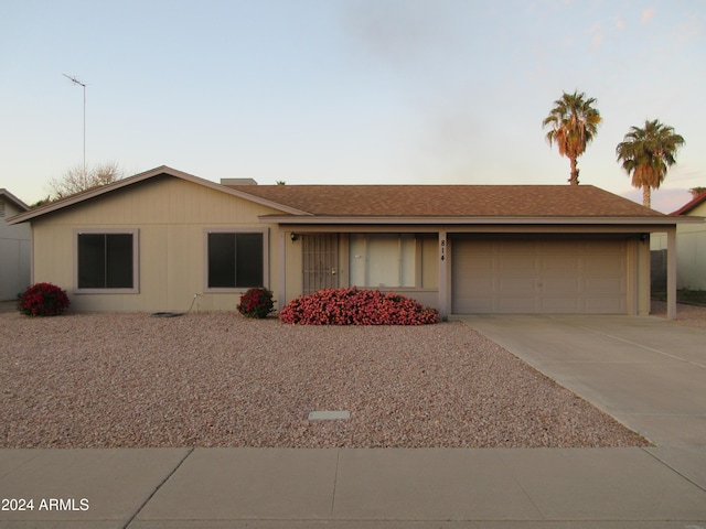 single story home with a garage