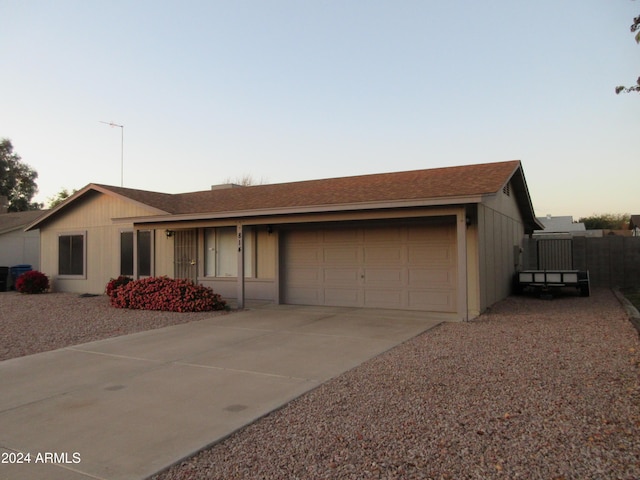 single story home featuring a garage