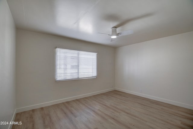 unfurnished room featuring ceiling fan and light hardwood / wood-style floors