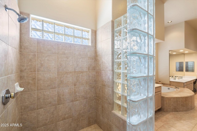 bathroom with a garden tub, tile patterned flooring, walk in shower, vanity, and recessed lighting