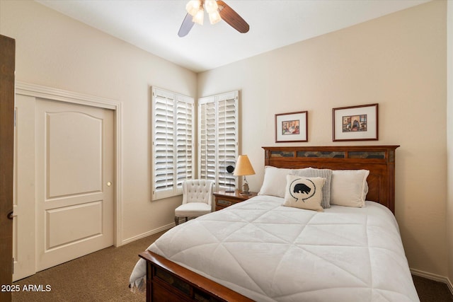 carpeted bedroom with ceiling fan and baseboards