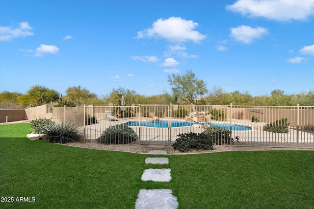 view of pool with a yard, a patio area, fence, and a fenced in pool