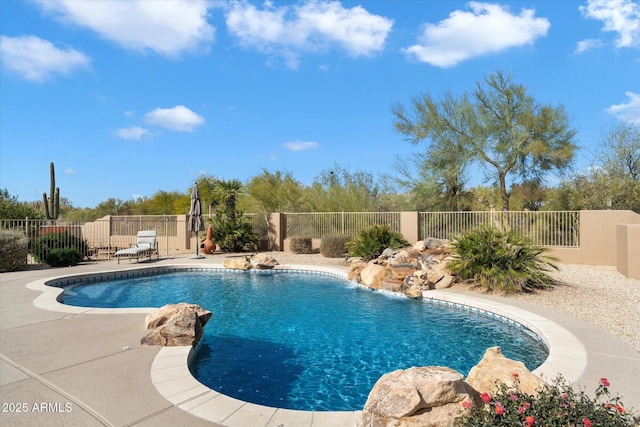 view of swimming pool featuring a fenced in pool, fence, and a patio