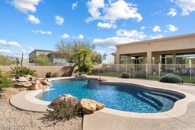 view of swimming pool with a fenced in pool and a fenced backyard