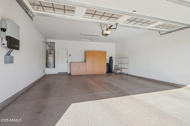 garage featuring a garage door opener and water heater