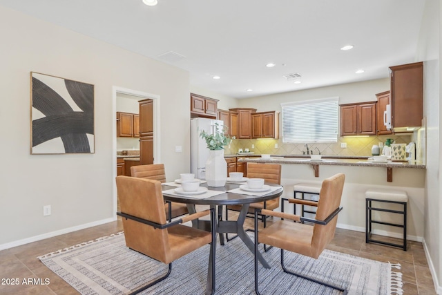 dining space with light tile patterned flooring