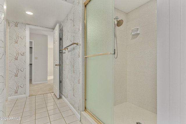 bathroom featuring walk in shower and tile patterned flooring