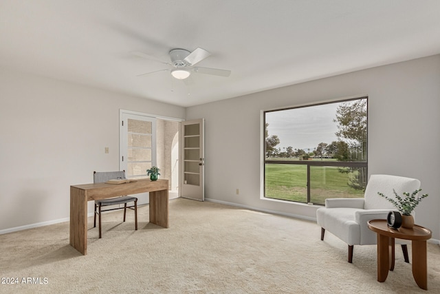 home office with ceiling fan and light colored carpet