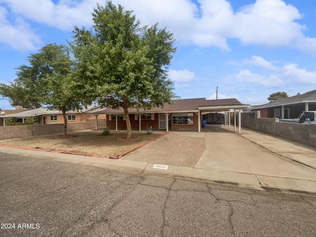 view of front of home with a carport