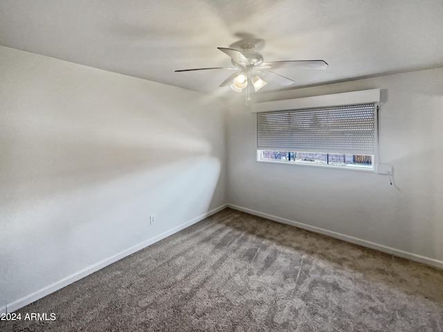 carpeted empty room featuring ceiling fan