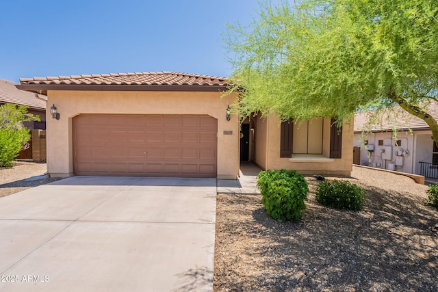 1927 W Mine Trl, Phoenix, AZ 85085 - view of front facade featuring concrete driveway, a garage, stucco siding, and a tile roof