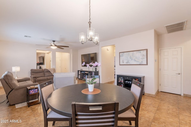 1927 W Mine Trl, Phoenix, AZ 85085 - dining space with a chandelier, a ceiling fan, and light tile patterned flooring