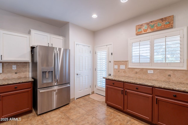 1927 W Mine Trl, Phoenix, AZ 85085 - kitchen with stainless steel fridge, backsplash, plenty of natural light, and recessed lighting