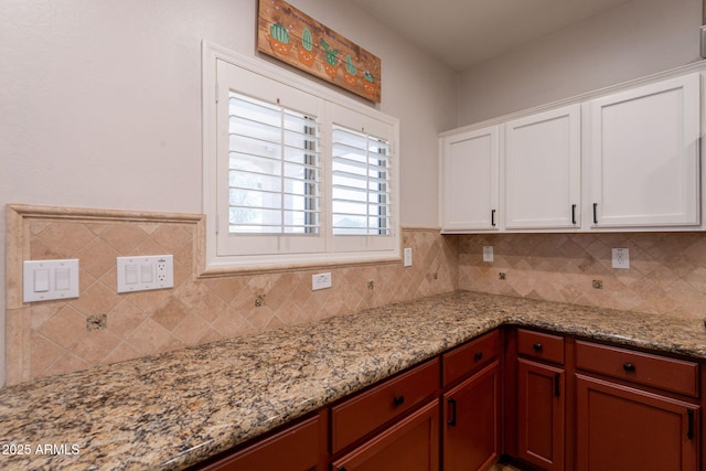 1927 W Mine Trl, Phoenix, AZ 85085 - kitchen with tasteful backsplash, white cabinets, and light stone countertops