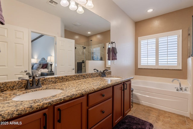 1927 W Mine Trl, Phoenix, AZ 85085 - full bathroom featuring ensuite bath, a shower stall, a garden tub, double vanity, and tile patterned floors