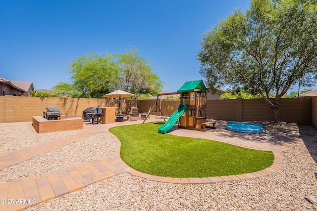 1927 W Mine Trl, Phoenix, AZ 85085 - view of play area with a fenced backyard and a patio