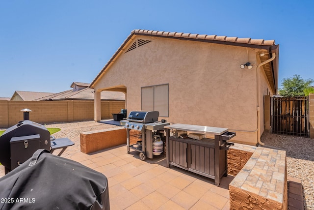 1927 W Mine Trl, Phoenix, AZ 85085 - fenced backyard featuring a patio and grilling area