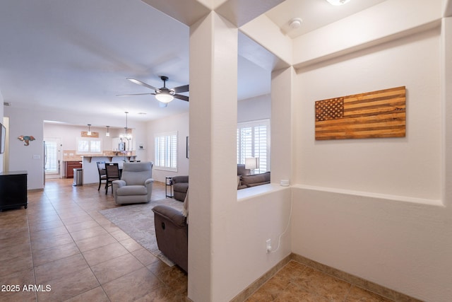 1927 W Mine Trl, Phoenix, AZ 85085 - corridor with tile patterned floors and a chandelier