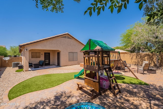 1927 W Mine Trl, Phoenix, AZ 85085 - back of property with a playground, a patio, a fenced backyard, and stucco siding