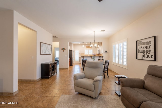 1927 W Mine Trl, Phoenix, AZ 85085 - living room featuring a chandelier and light tile patterned floors