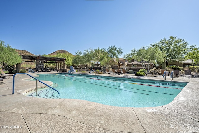 1927 W Mine Trl, Phoenix, AZ 85085 - community pool featuring a patio and a mountain view