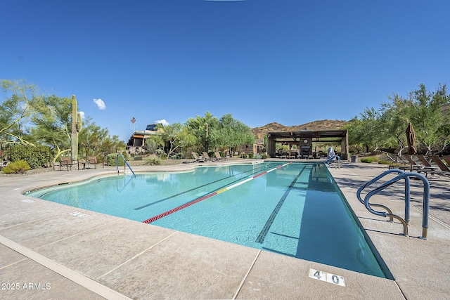 1927 W Mine Trl, Phoenix, AZ 85085 - community pool with a patio area and a mountain view