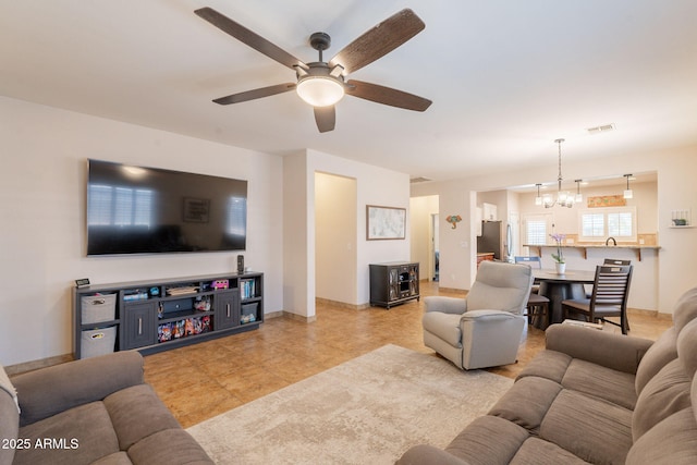 1927 W Mine Trl, Phoenix, AZ 85085 - living room with a chandelier and a ceiling fan