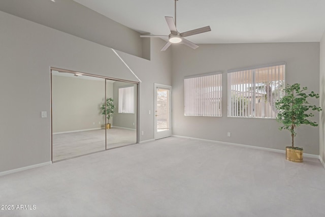 unfurnished bedroom with lofted ceiling, light colored carpet, and ceiling fan