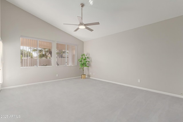 unfurnished room featuring ceiling fan, carpet, and lofted ceiling