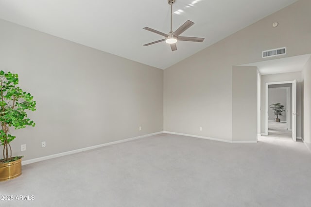 carpeted empty room featuring ceiling fan and lofted ceiling