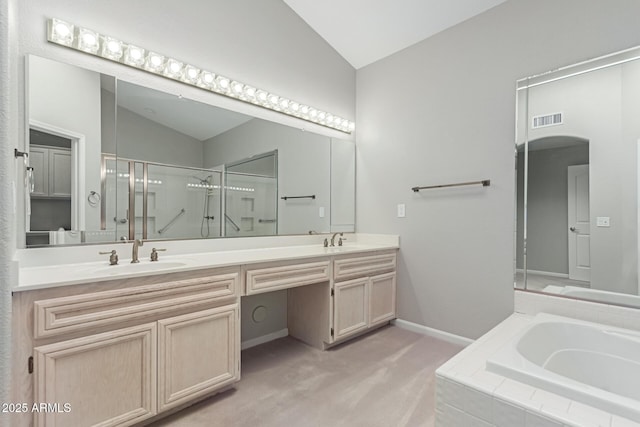 bathroom with vanity, lofted ceiling, and shower with separate bathtub