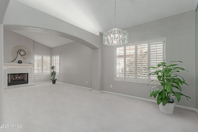 living room featuring carpet flooring, a fireplace, and lofted ceiling