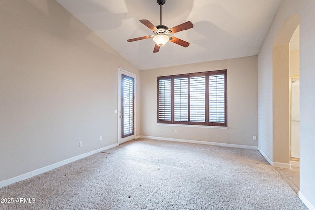 15809 S 31st St, Phoenix, AZ 85048 - empty room featuring light colored carpet, ceiling fan, lofted ceiling, baseboards, and arched walkways