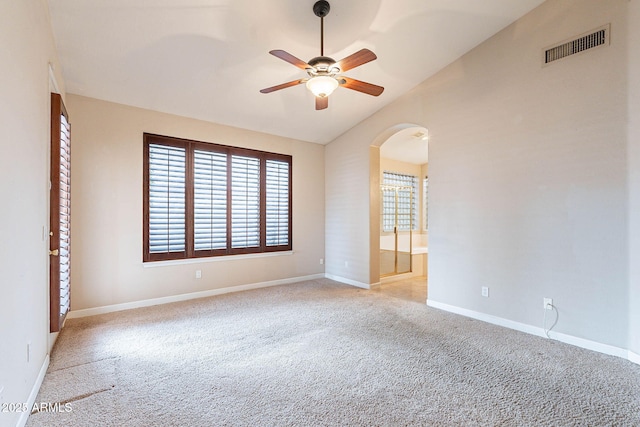 15809 S 31st St, Phoenix, AZ 85048 - spare room featuring lofted ceiling, arched walkways, carpet flooring, ceiling fan, and baseboards